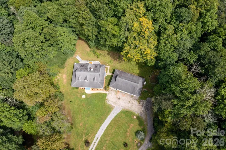 Aerial photo of the home and workshop/garage - notice the circular driveway for ease