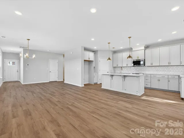 Kitchen features 42-inch cabinets with soft close drawers & doors- Frigidaire professional appliances. Walk-in pantry with solid shelving