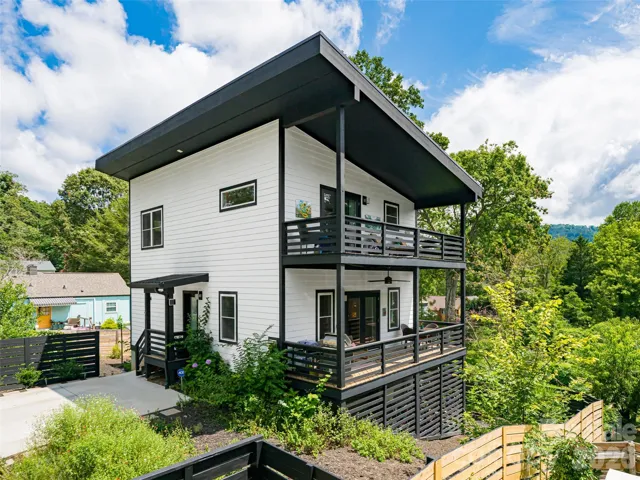Contemporary 3 level home in North Asheville built in 2022. Classic black & white design with beautiful fenced in yard and two large decks