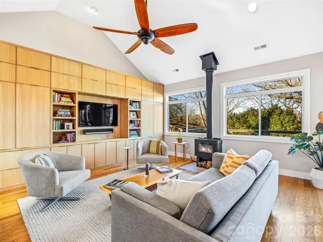 Great room with large windows and vaulted ceilings.