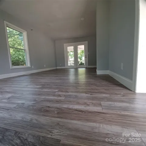 Family Room measuring 12 x 24 leading to 8 x 12 covered porch with french doors