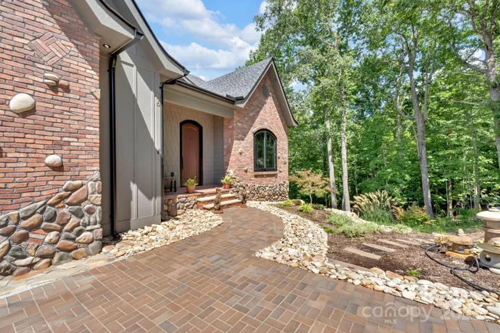 Custom kilnker brick pathway, custom brick and stone pattern and luxury landscaping