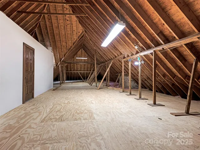 Attic space with entrance to cedar closet