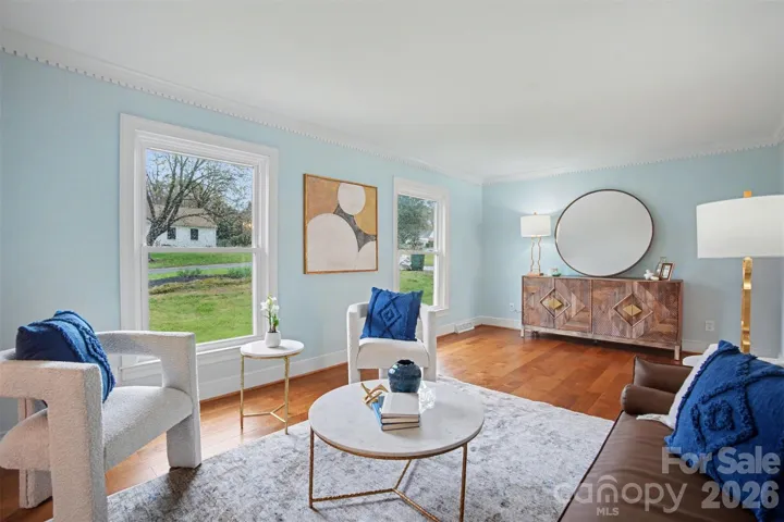 BEAUTIFUL FORMAL LIVING AREA WITH OVERSIZED WINDOWS WINDOWS