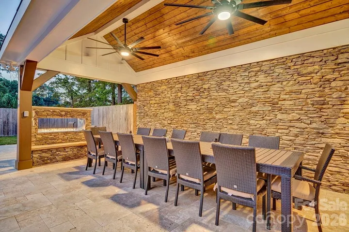 Pool Courtyard Pavilion; timber columns, cathedral tongue & groove ceiling w/ceiling fans and large gas fireplace.