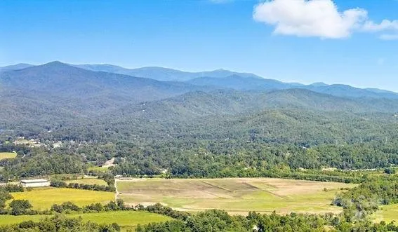 Come build your dream home here and experience Blue Ridge mountain views potential from your 14.97-acre homesite looking towards Black Mountain and Mount Pisgah in Pisgah National Forest. The sunsets will be amazing.