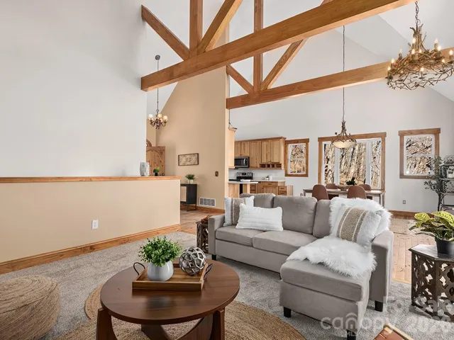 Stunning Interior Featuring Custom Finishes And Vaulted Ceilings With Exposed Natural Wood Trusses