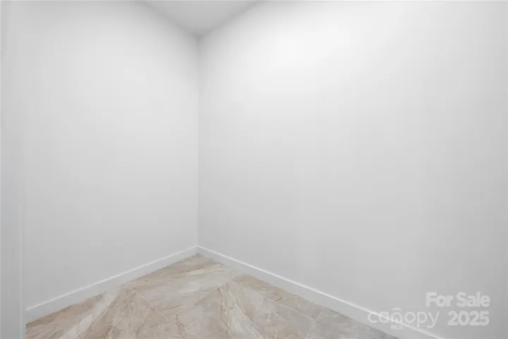 Main-level primary suite - one of two walk-in closets