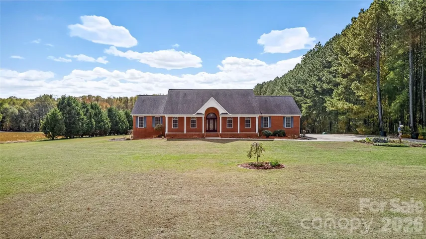 3987 NC Highway 27, Lincolnton North Carolina - Set on 7.5 picturesque acres, this full-brick custom ranch estate offers the perfect blend of refined comfort and peaceful rural charm! Make it your new home today!!