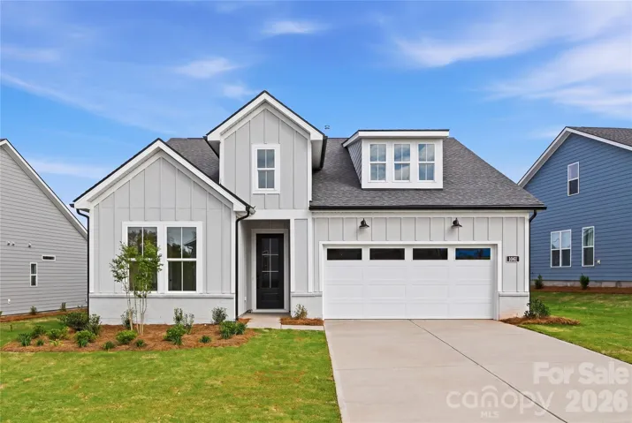 Impressive modern farmhouse architecture welcomes you home!
