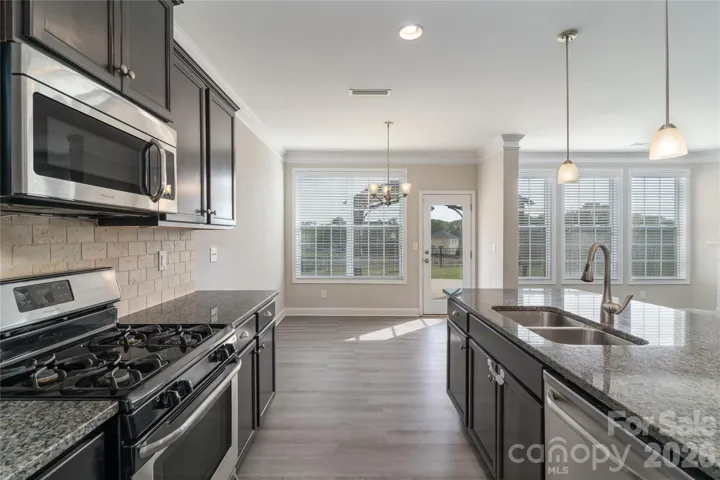 Stainless steel appliances and breakfasrt nook