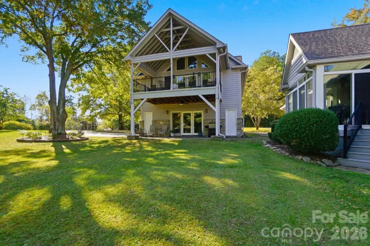 The owners refer to this as "The Treehouse". Built with a second living area upstairs and an oversized five-car garage or hobby shop below. 