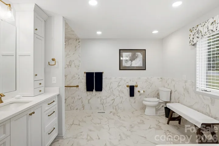 Completely remodeled primary bath in 2023 designed with wheelchair accessibility in mind.