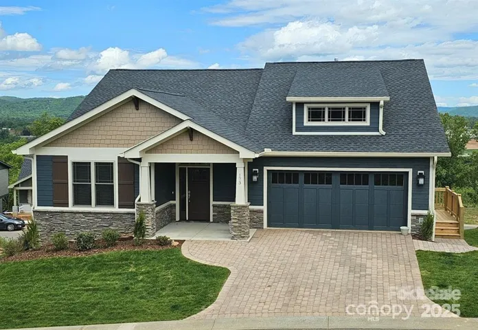Gorgeous Craftsman home. Photo is a similar model home.