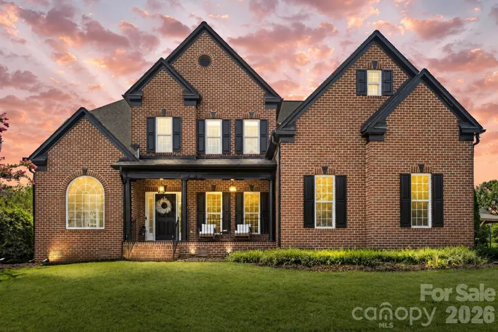Front exterior at dusk. *Photo has been virtually enhanced.*