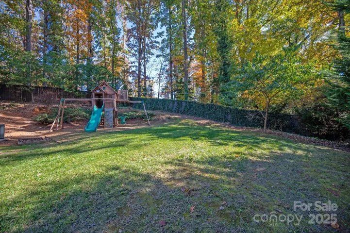 Private Backyard w/ play set  to convey. 