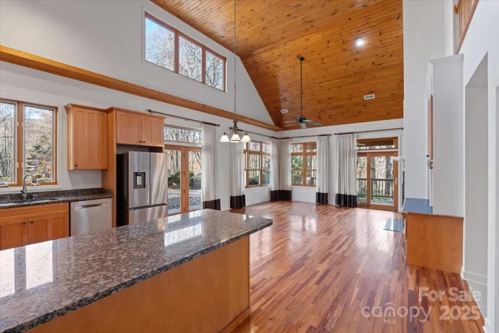 Entering from the port cochere, you're welcomed with the warmth of the hardwood floors & stunning vaulted tongue & groove ceiling.