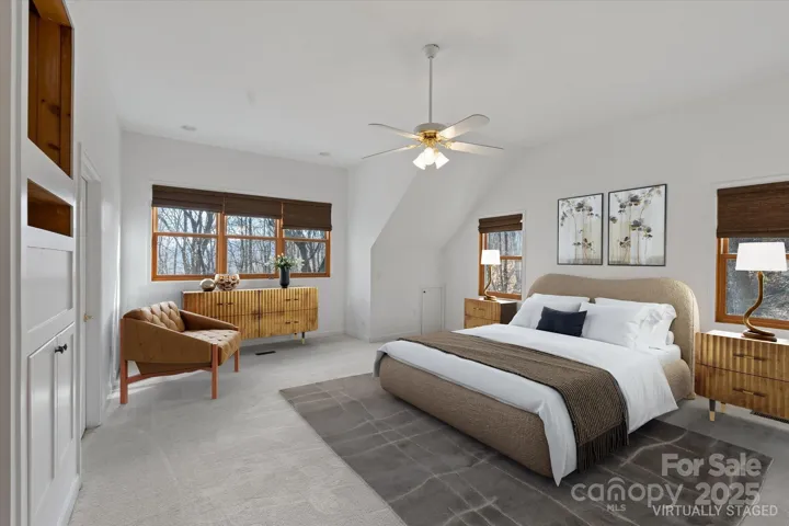 Virtually staged primary bedroom on upper level