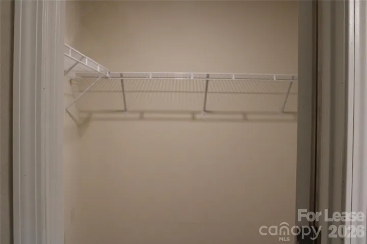 Walk-in closet in primary bedroom