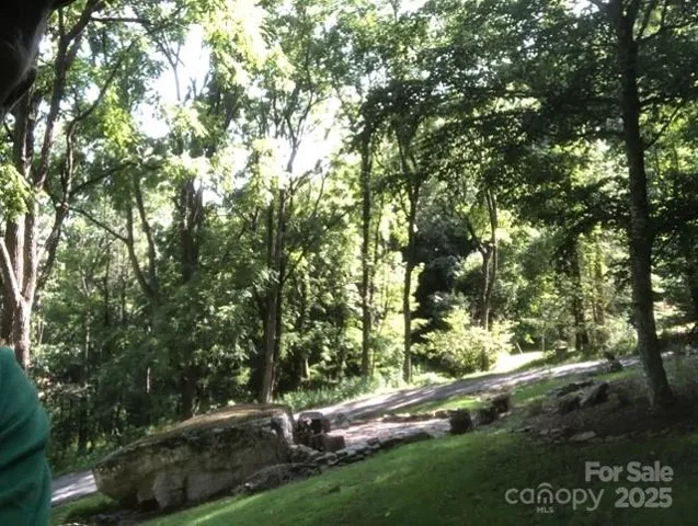 Love the big climbing rock and firepit. 