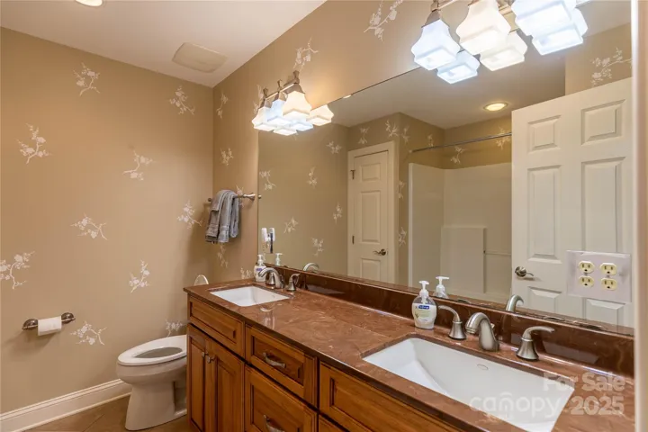 This lower level bath is private and nicely furnished . 