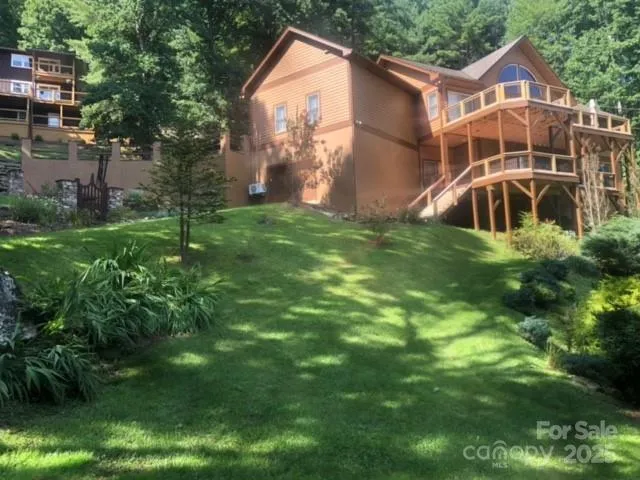 Another view of the landscape. Daisies and hydrangea brighten the lawn in summer. Scattered solar lights give a fabulous look at night. 
