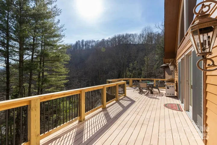 Decks have new railings with treated wood posts and aluminum pickets for beautiful look. 