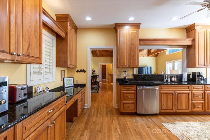 Open wall over sink allows view into family room and dining area. 