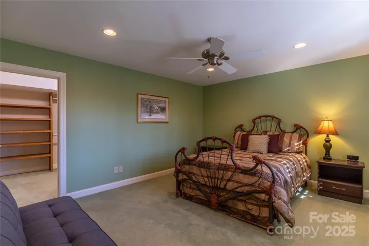 Third bedroom on lower level has a walk in closet you won't believe! Futon for seating or extra sleep option if needed. Iron bed will not convey. 