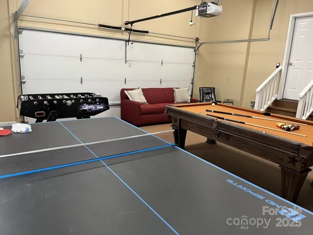 Evey mountain house needs a game room and this 2 car garage fits the bill. It's heated and cooled, has pool table, foos balll, ping pong, and a sleep sofa . 