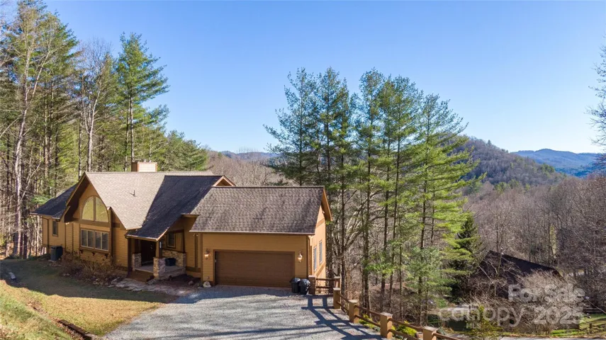 Front entrance to home has covered entry and parking area for 4 vehicles on the drive. 