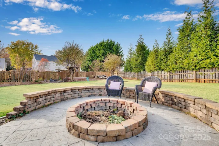 Firepit to the side of the pool