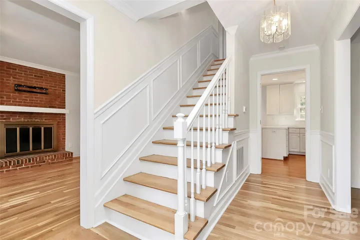 Stairs near front door to upper level