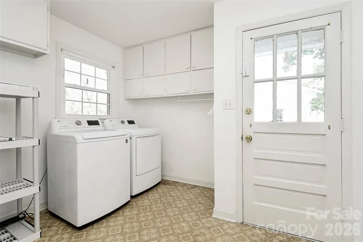 Spacious laundry and mud room at side entrance- washer and dryer remain
