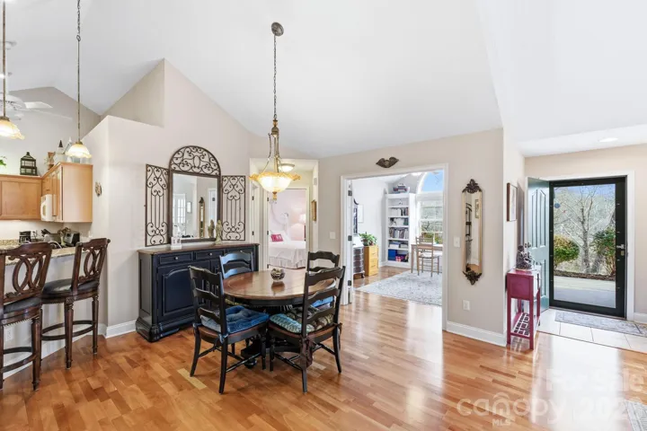 Dining area has custom lighting and generous space 