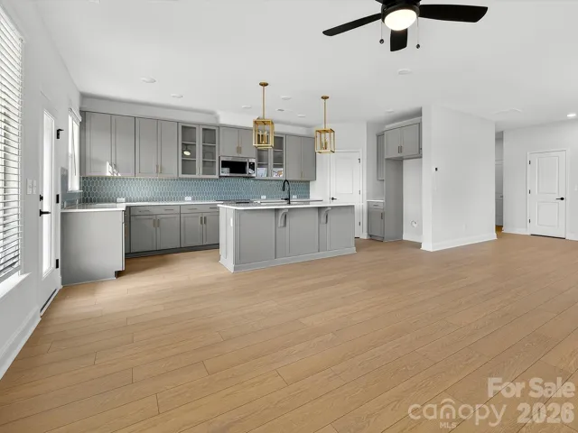 42" cabinets with soft close doors and drawers, quartz countertops, tile backsplash. Frigidaire gallery appliances. Microwave is exhaust vented to the outside. Large pantry with solid shelving