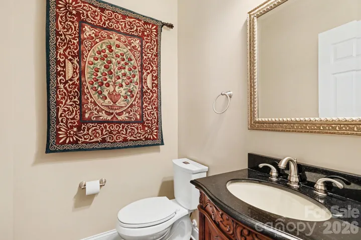 Bathroom 1: 1/2 bath downstairs