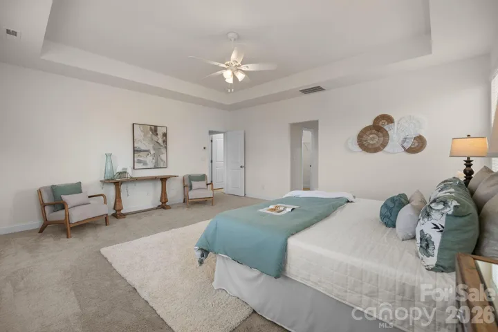 Bright and tranquil, with plenty of space for a sitting area or reading nook.