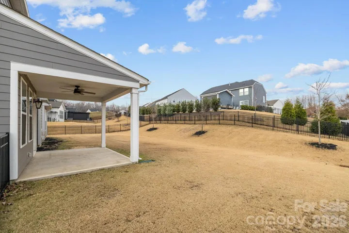Fully fenced backyard provides space for play, pets, and outdoor relaxation.
