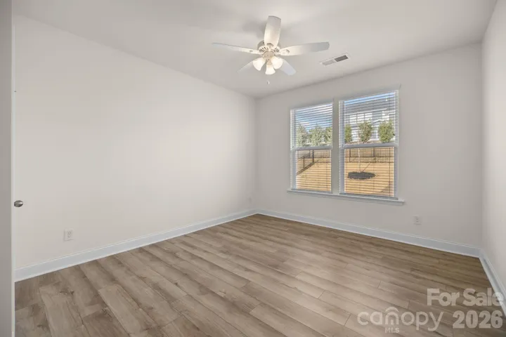 Main-level guest suite with ensuite bath provides ideal flexibility for visitors or multigenerational living.