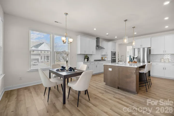 Light-filled breakfast area overlooks the backyard, making casual meals bright and inviting.