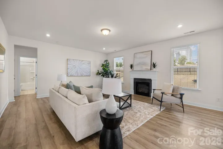 Large windows bring in natural light and showcase backyard views.