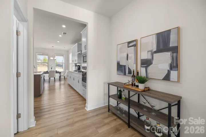 Ideally located butler’s pantry offers the perfect setup for a bar and effortless entertaining, complemented by a remarkably spacious walk-in pantry just steps away.