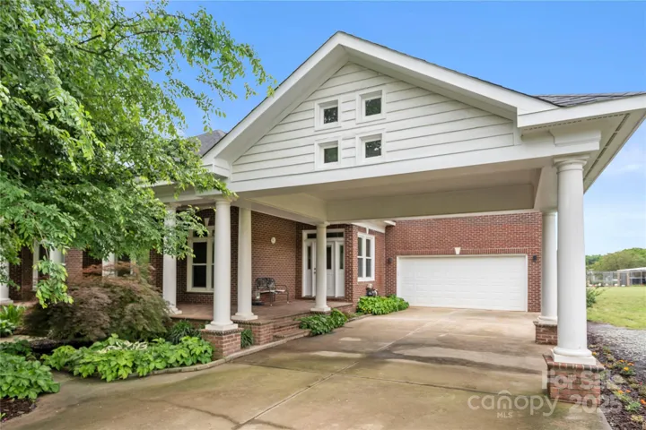 Custom built home with hardwood floors, 2 car carport and 2 car garage