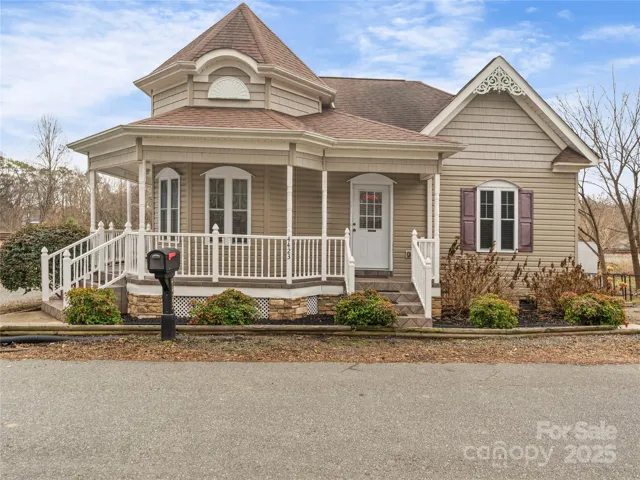 Front view of this beautiful property with wrap around porch