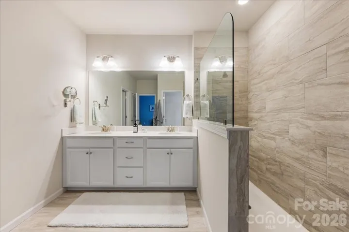 Primary ensuite bathroom with double vanity