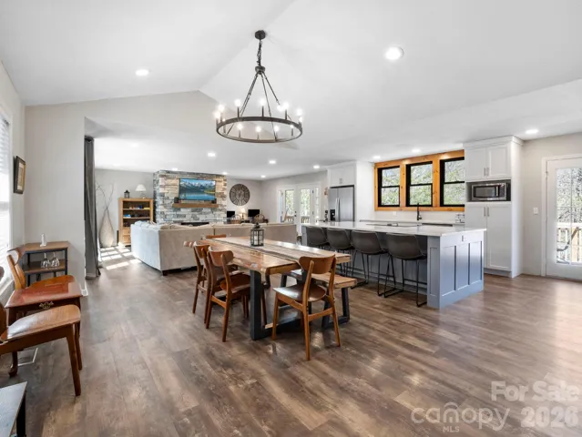 Open concept on the main level with an ensuite primary bedroom, two additional guest bedrooms, and guest bath.
