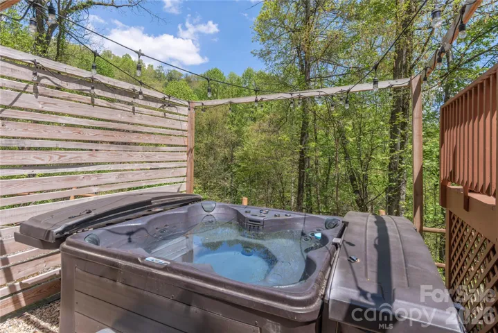 Private hot tub with wooded mountain views