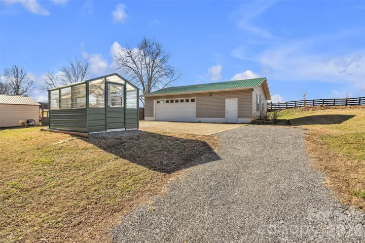 Detached garage and greenhouse that will convey