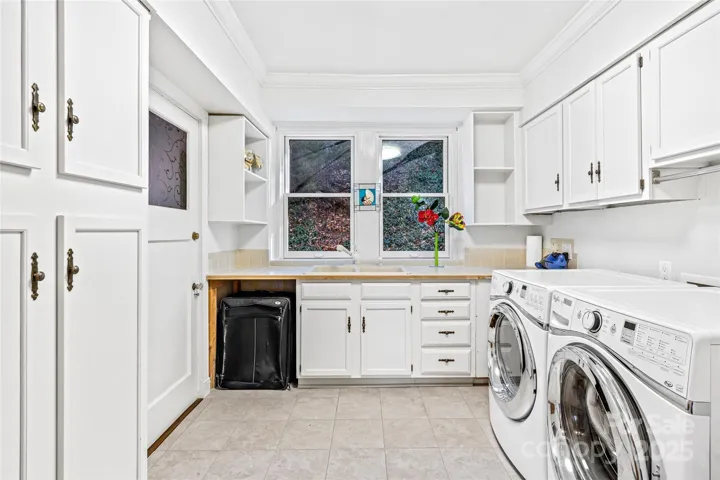 Large laundry room with built-ins